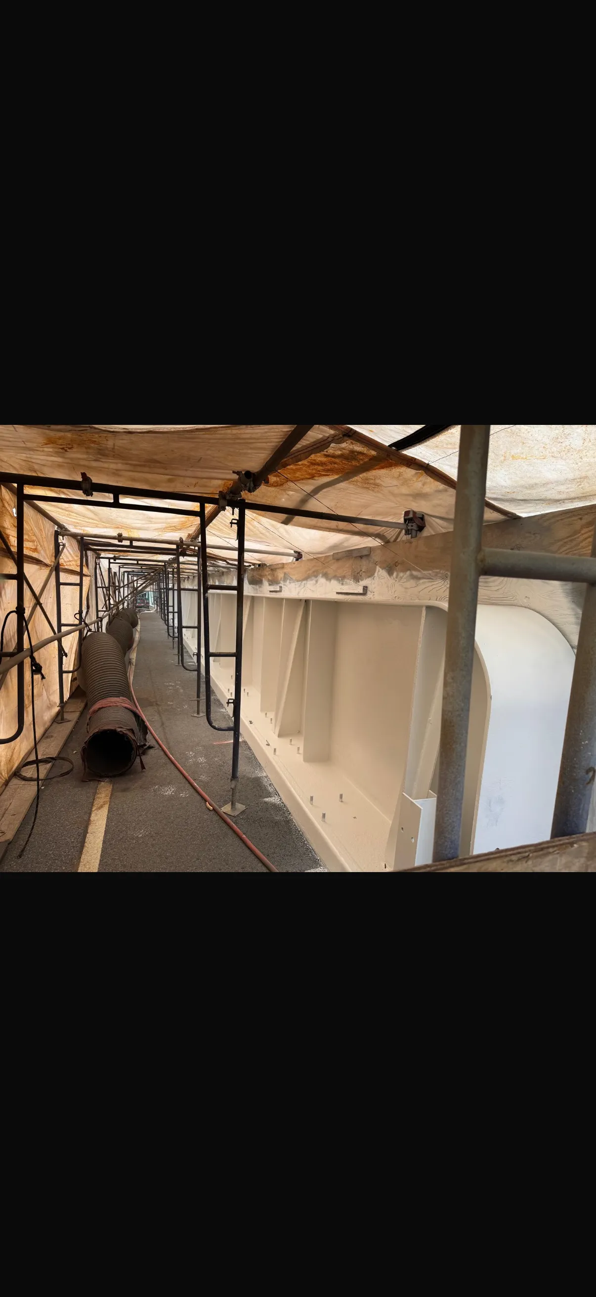 Steel bridge beam after: freshly coated with protective primer