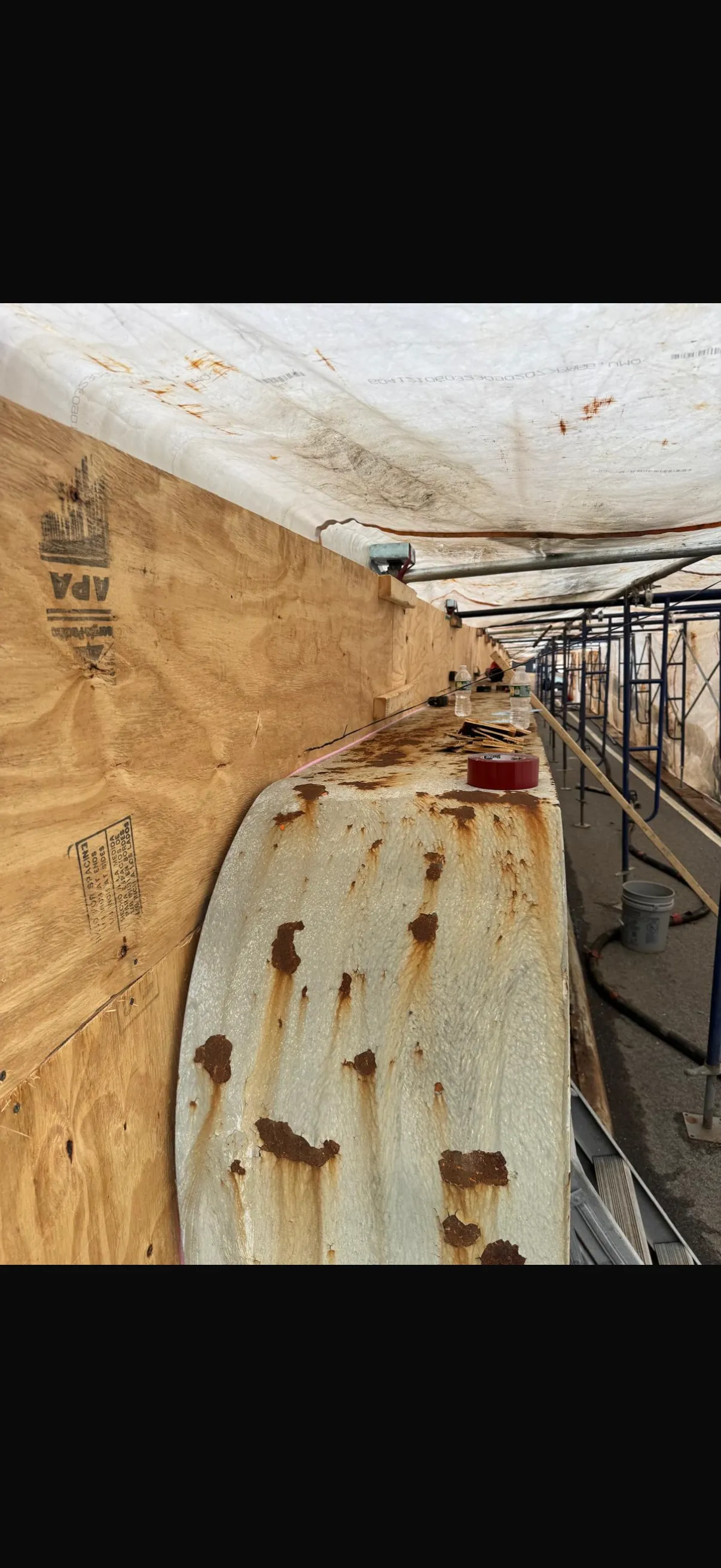 Steel bridge beam before: heavy rust and corrosion