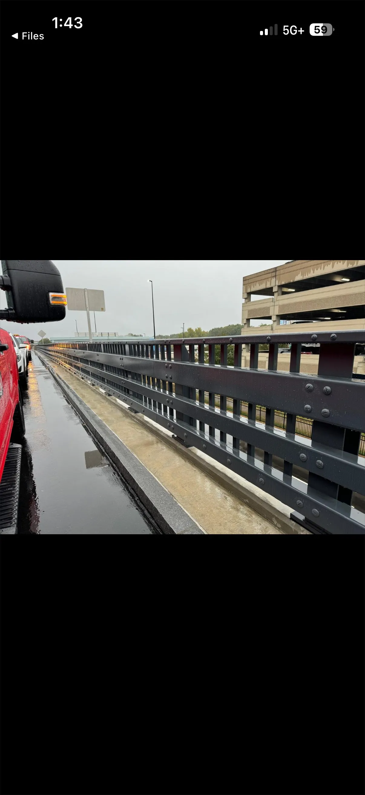 Bradley Airport infrastructure project showing guardrail and fencing installation