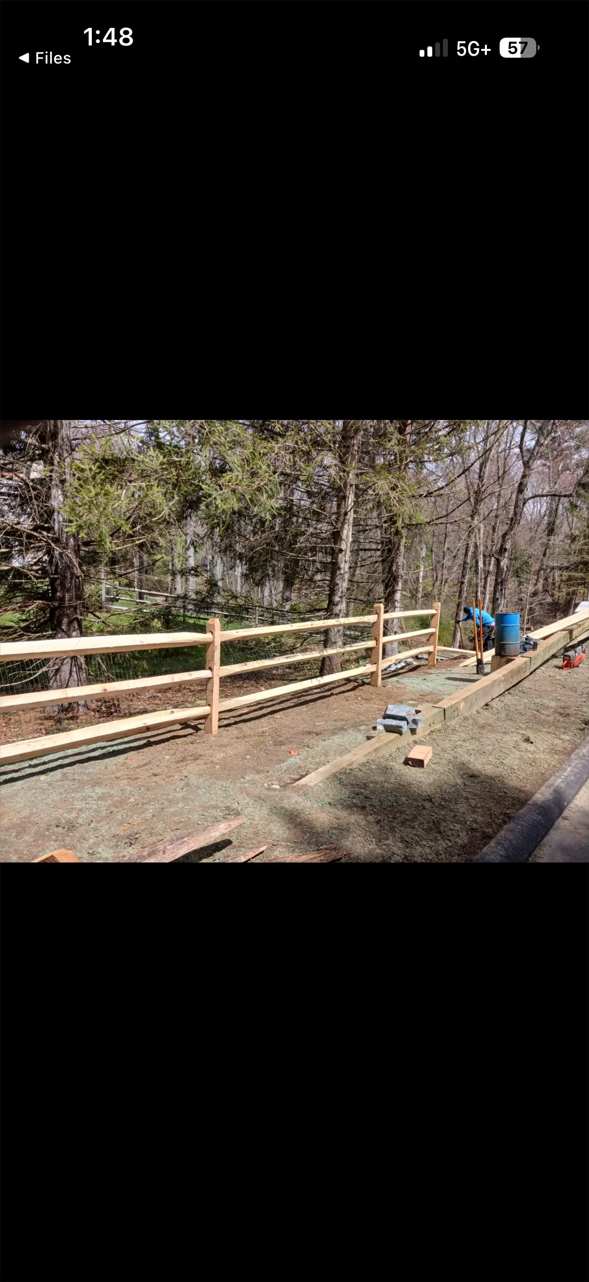 Finished guardrail and fence section showing completed installation