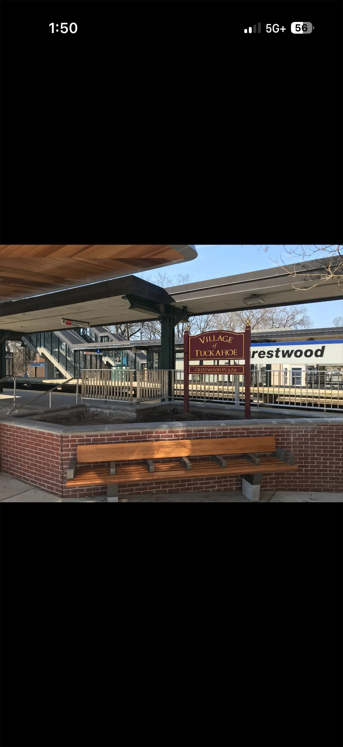 Railroad station platform and infrastructure showing completed paint and structural work