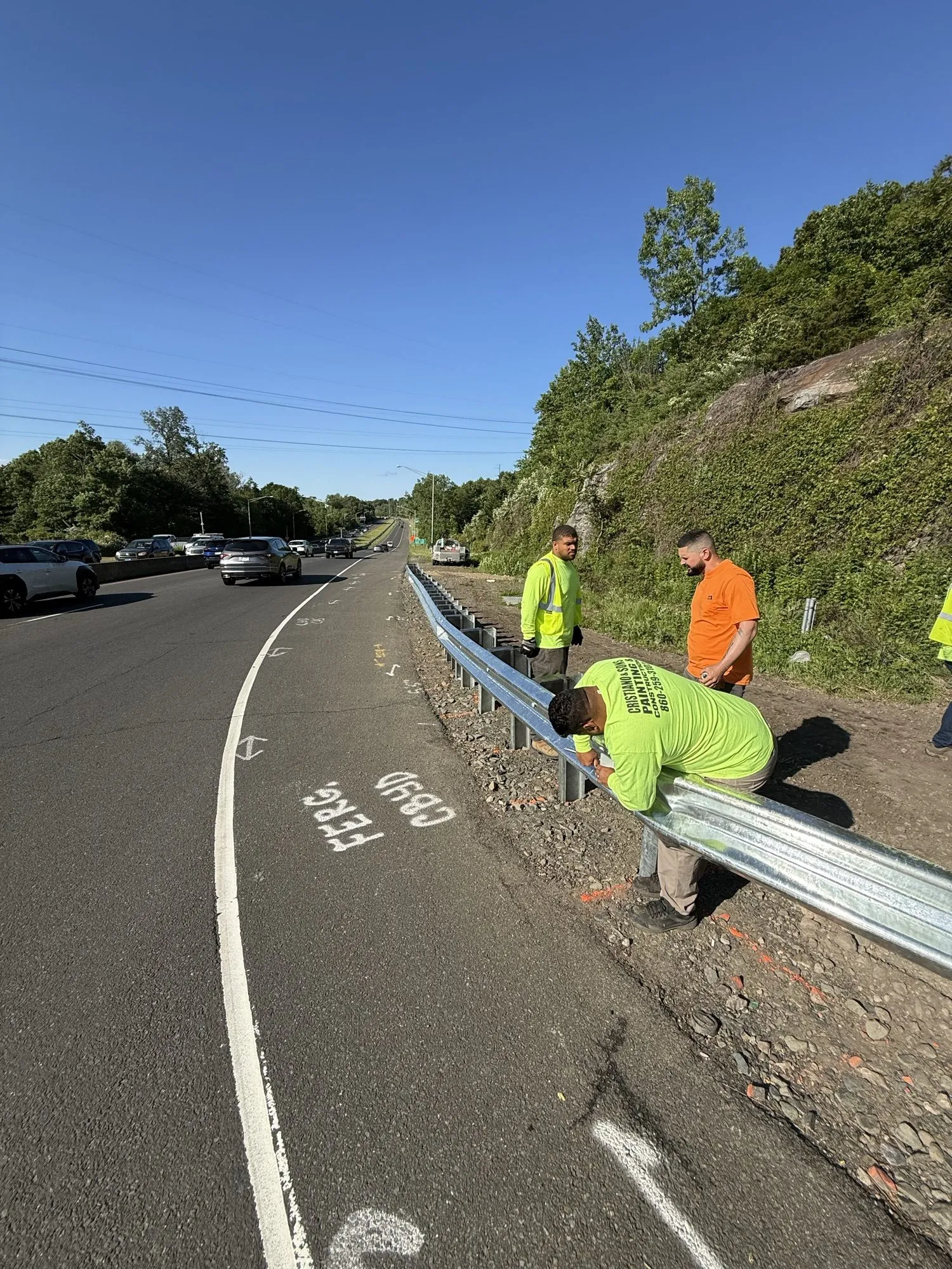 Cristiano & Son crew installing guardrail to grade along a Connecticut road