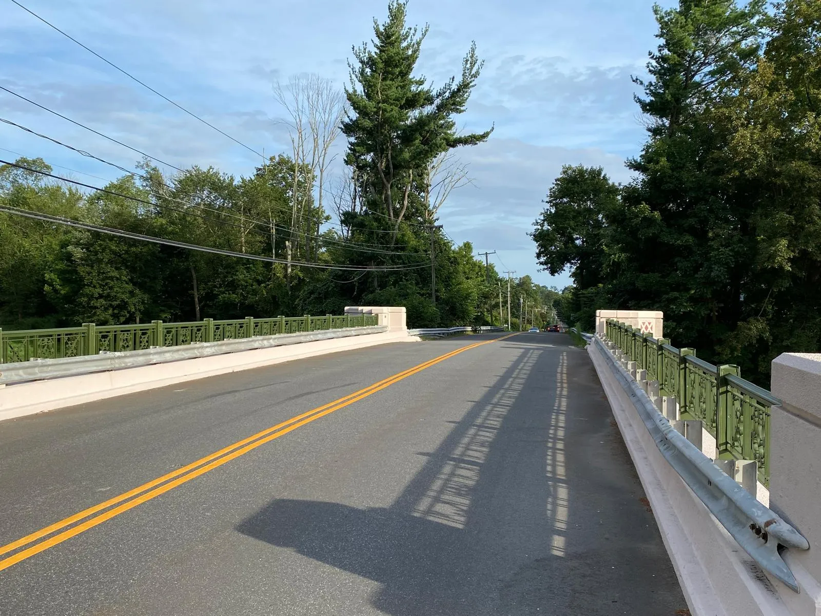 Completed ornamental bridge with green Art Deco railings