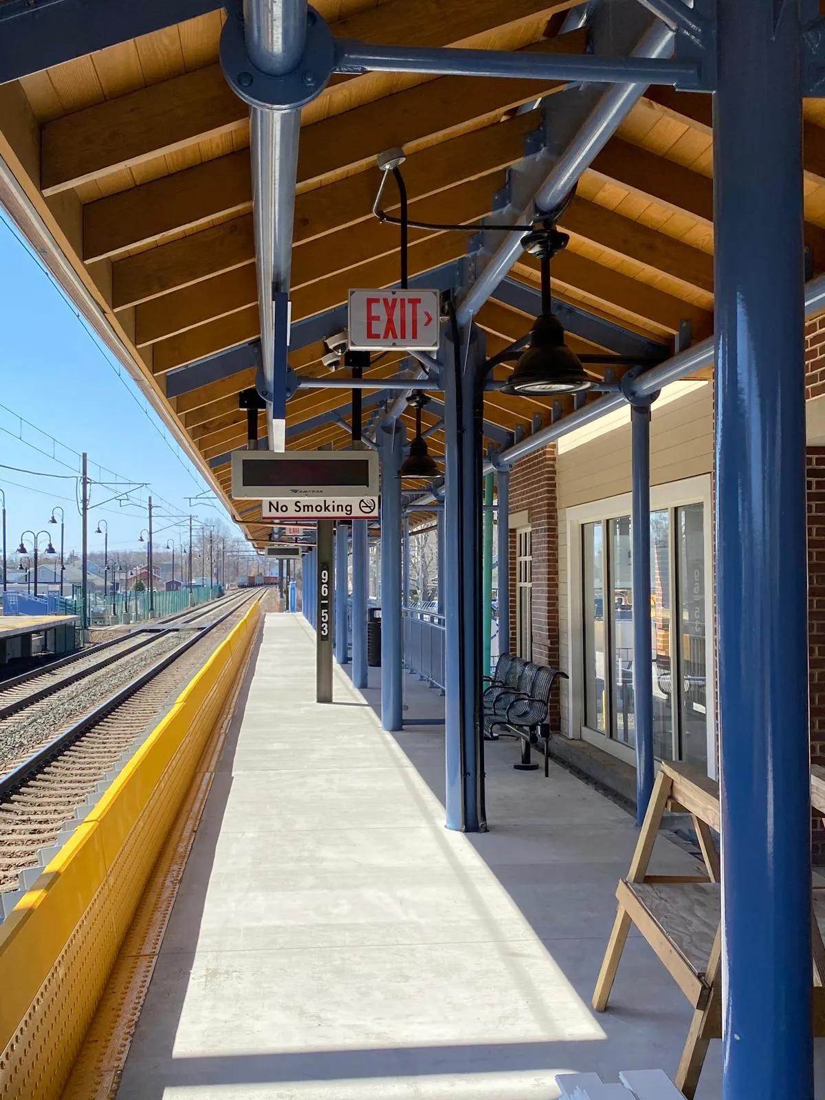 Completed railroad station with freshly painted blue steel columns